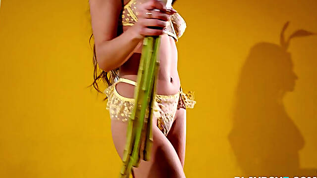 Curvy Asian teen Kelly Lu gives a sensual striptease for Playboy