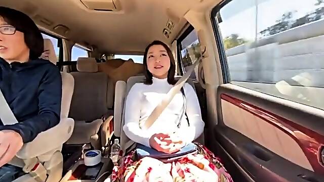 Hot Japanese babe gets her juicy peach fingered in the car