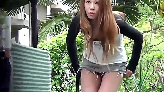 Adriana Chechik caught peeing in public while wearing high heels and wearing her brunette hair out