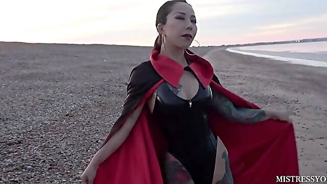 Caped domme by the Ocean