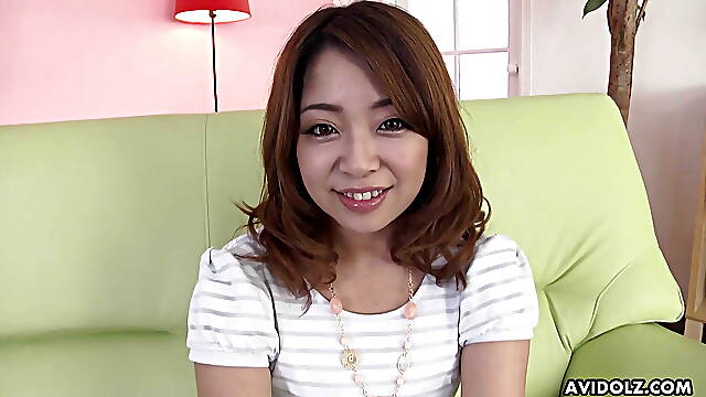 Japanese woman Mirei Oomori gently masturbates with a sex toy uncensored.